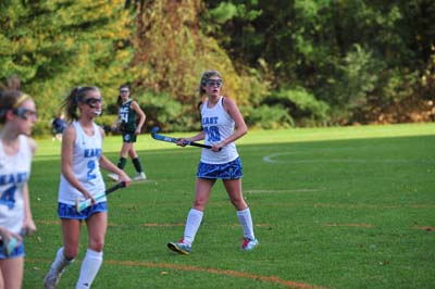 field hockey team in action