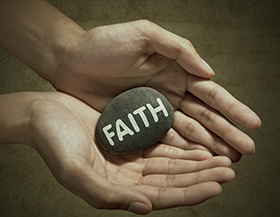 Rock in Hands with Faith written on it