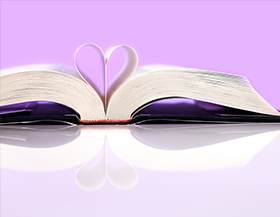 Open book with heart in pages